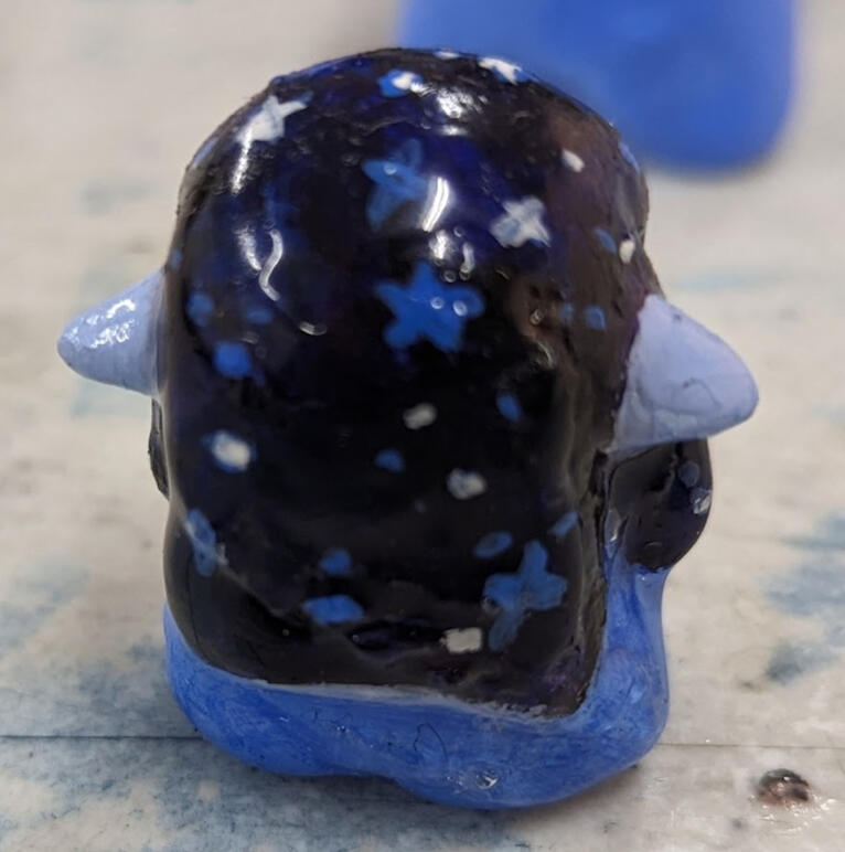 back of cosmic miniature