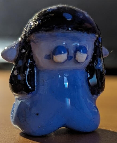 A tiny 1 1/2 inch miniature of cosmic!