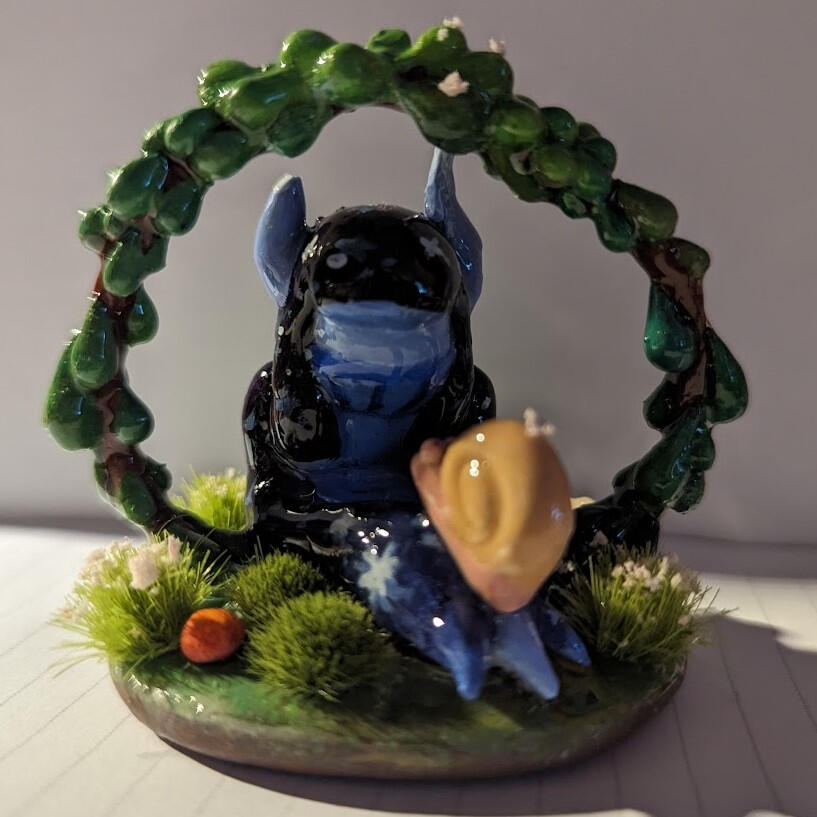 Going at a Snail&#39;s Pace - 4 inch tall clay figurine painted with acrylic and coated in UV resin. An attempt towards making custom figures for dioramas. Made April 24th, 2024.